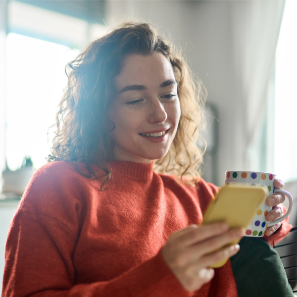 A lady looking at a mobile phone